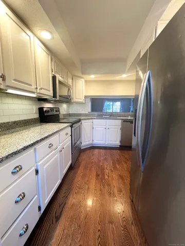 a large kitchen with cabinets