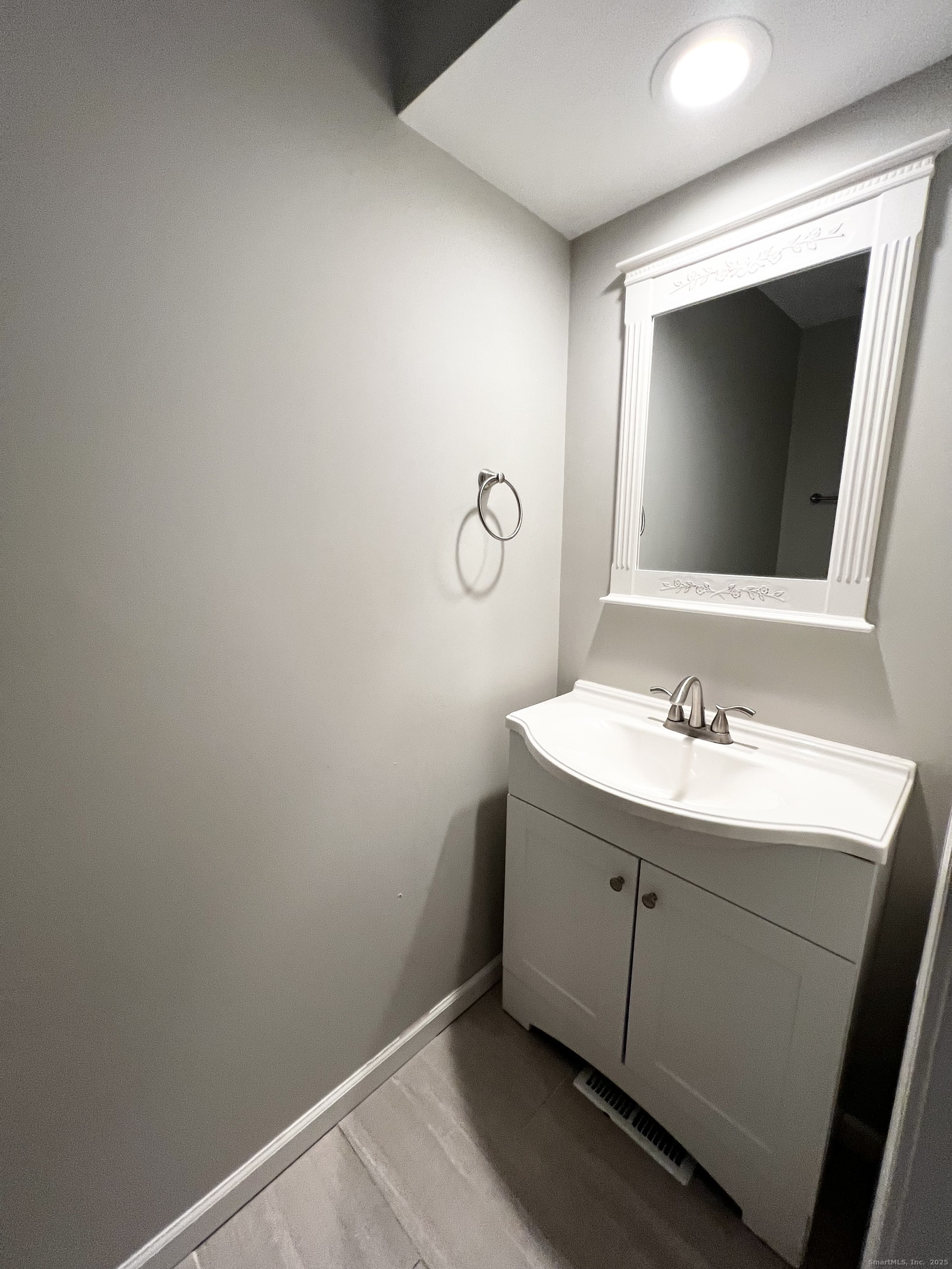 751 Long Hill Road, Unit D Middletown, CT 06457 - Photo 22 of 28 a bathroom with a sink and a mirror