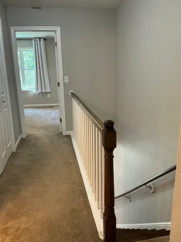 a view of a hallway with windows