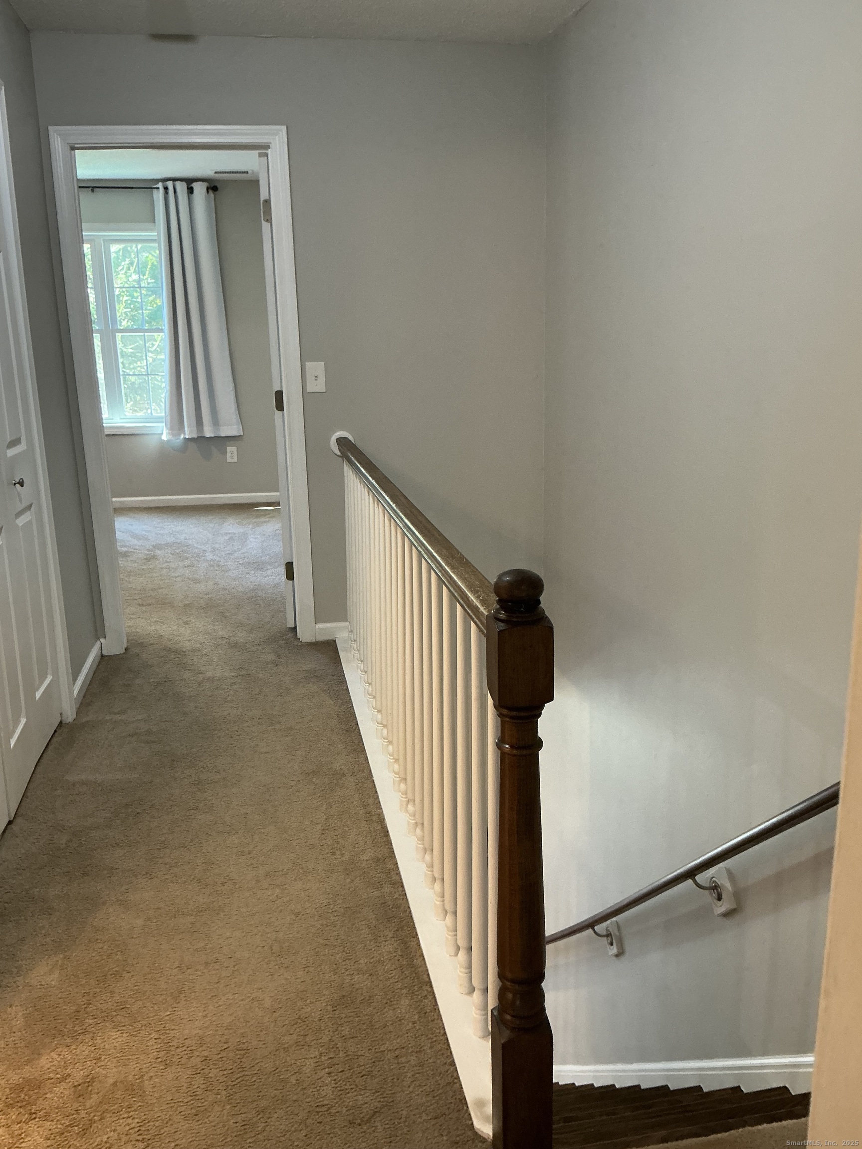 751 Long Hill Road, Unit D Middletown, CT 06457 - Photo 9 of 28 a view of a hallway with windows