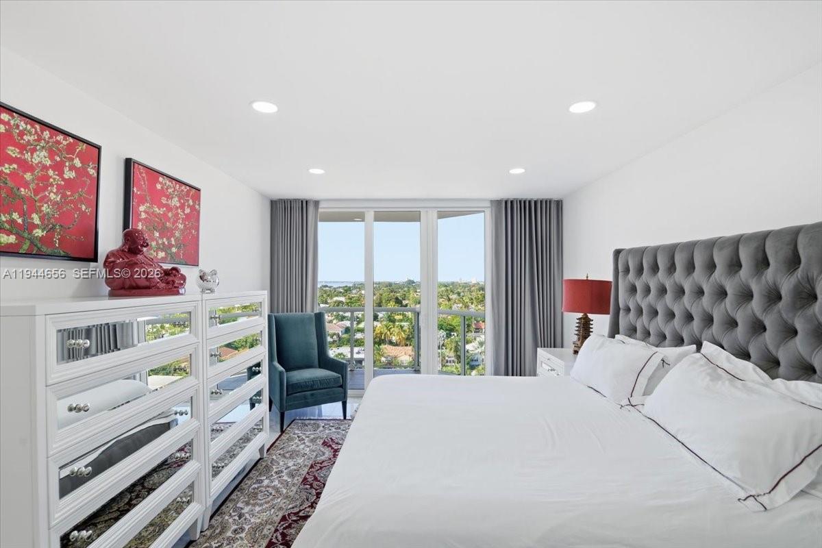 8925 Collins Avenue, Unit 9F Surfside, FL 33154 - Photo 12 of 73 a bedroom with a bed and a window