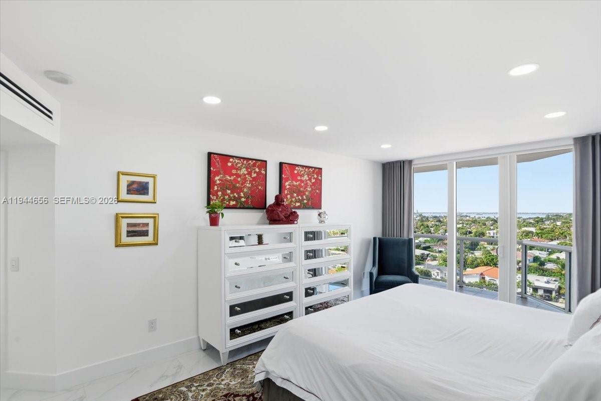 8925 Collins Avenue, Unit 9F Surfside, FL 33154 - Photo 13 of 73 a bedroom with a bed and a window