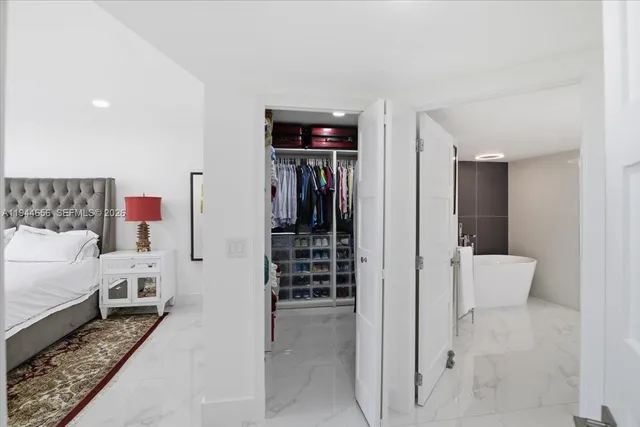 a bathroom with a glass door shower