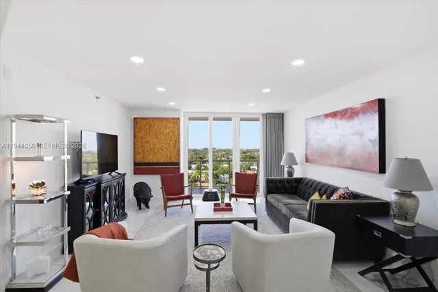 a view of a terrace with couches and a fire pit