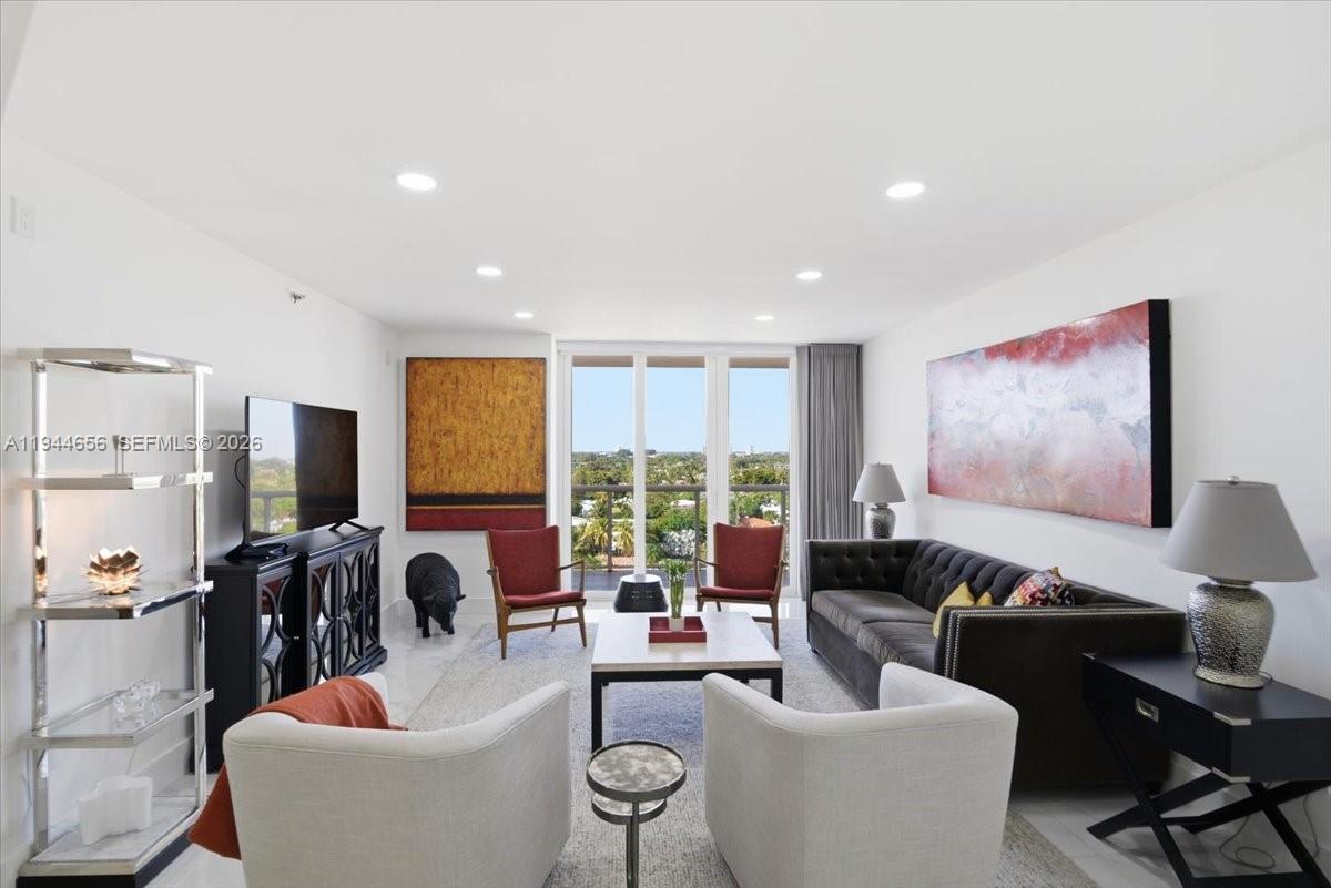 8925 Collins Avenue, Unit 9F Surfside, FL 33154 - Photo 34 of 73 a living room with furniture and a large window