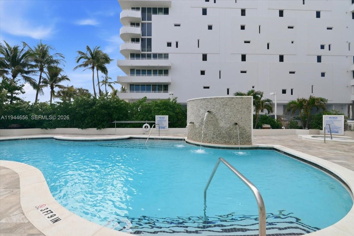 8925 Collins Avenue, Unit 9F Surfside, FL 33154 - Photo 44 of 73 a view of a swimming pool with an outdoor space