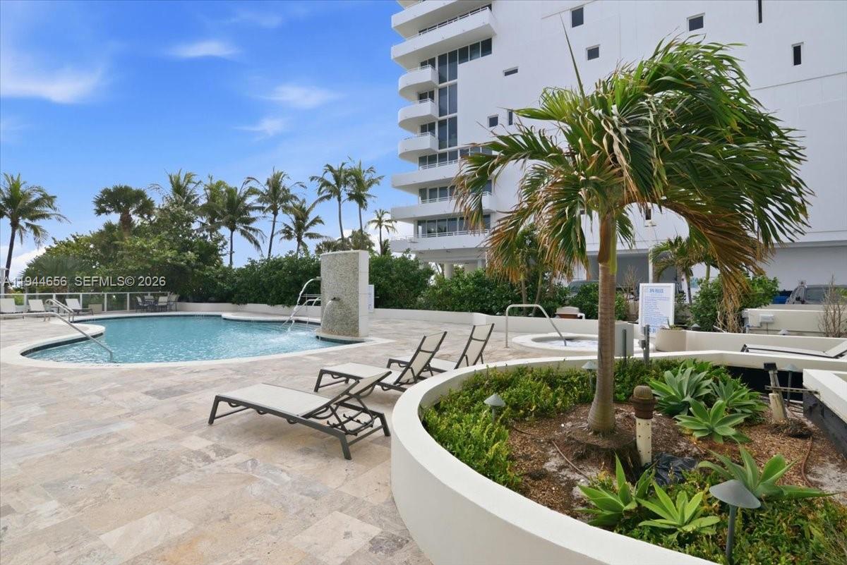 8925 Collins Avenue, Unit 9F Surfside, FL 33154 - Photo 47 of 73 a view of a swimming pool with a patio