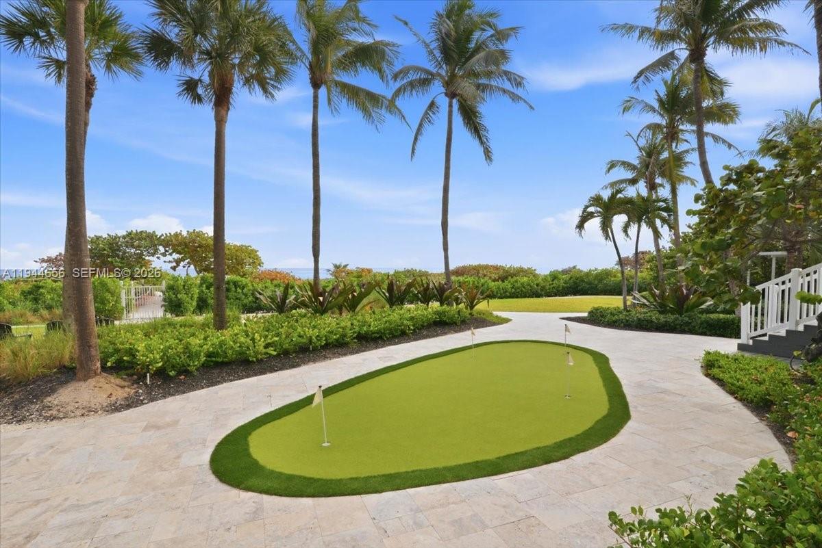 8925 Collins Avenue, Unit 9F Surfside, FL 33154 - Photo 50 of 73 a view of a swimming pool with a yard