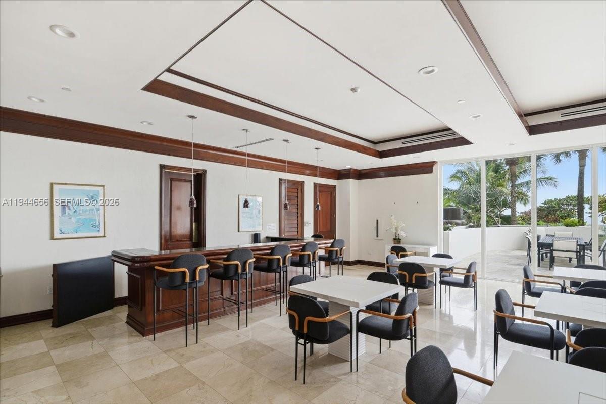 8925 Collins Avenue, Unit 9F Surfside, FL 33154 - Photo 57 of 73 a living room with lots of furniture and painting on the wall