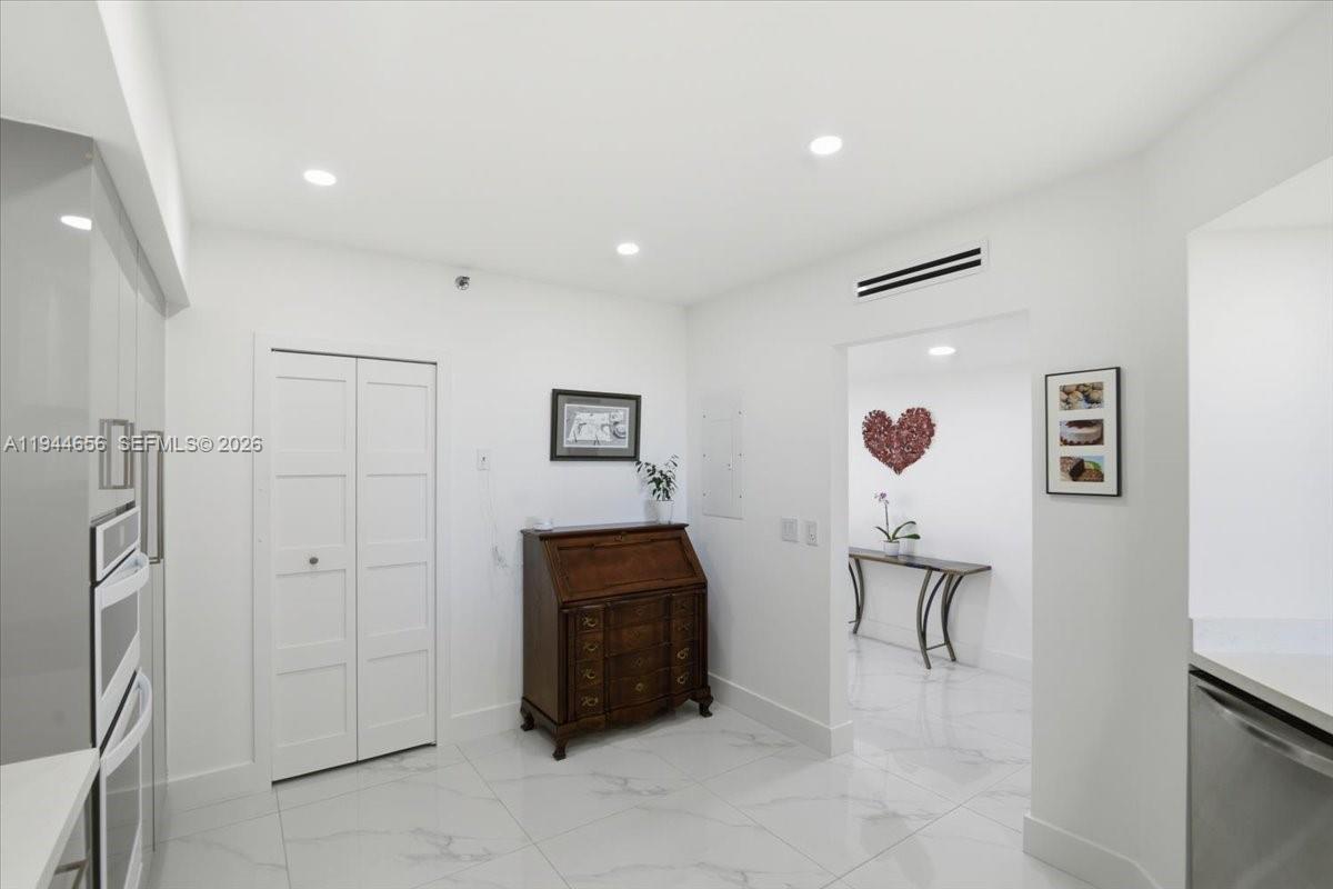8925 Collins Avenue, Unit 9F Surfside, FL 33154 - Photo 9 of 73 a living room with furniture and a painting on the wall
