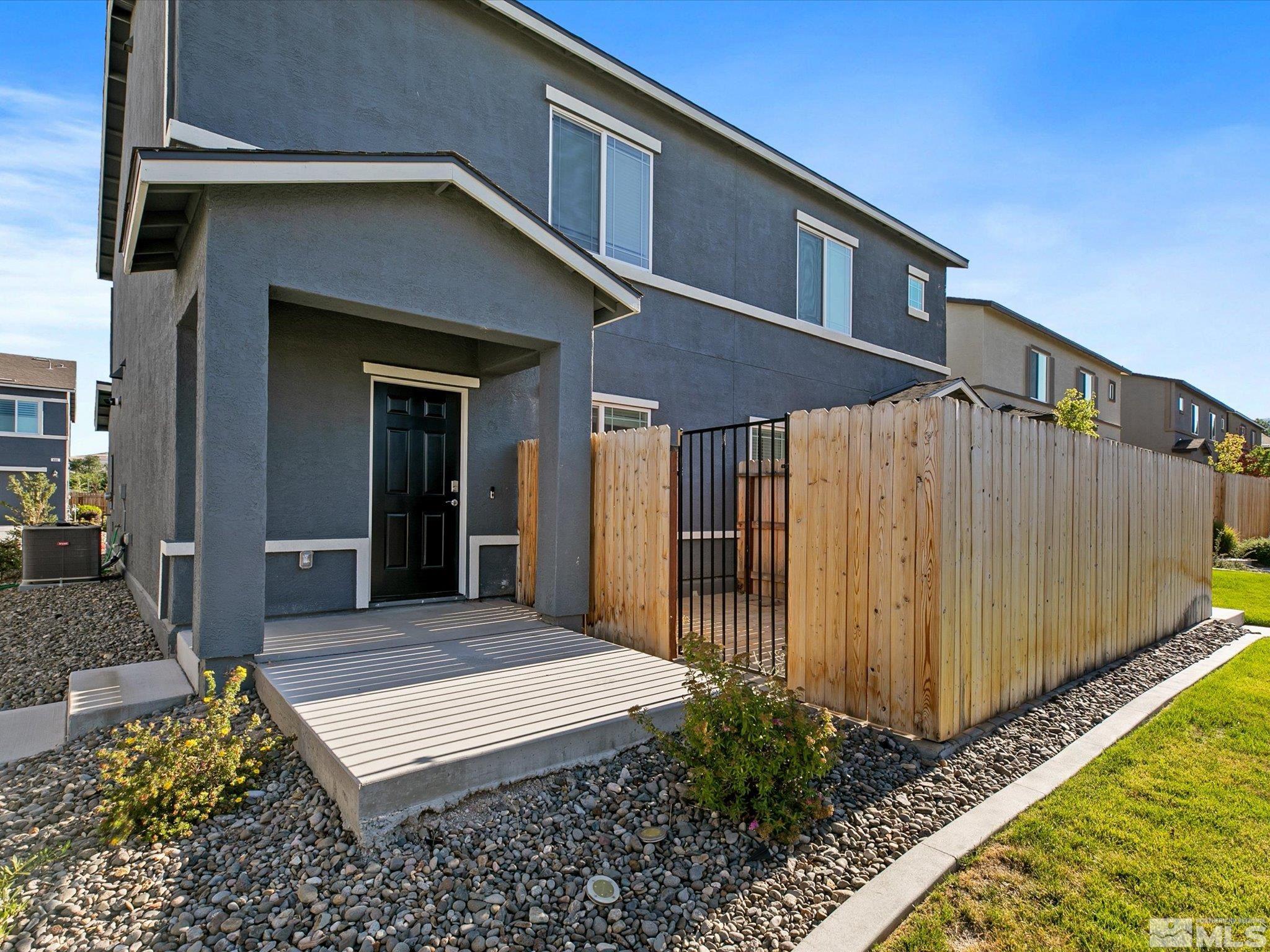 405 Autumn Breeze Circle Reno, NV 89511 - Photo 1 of 28 a front view of a house with a yard