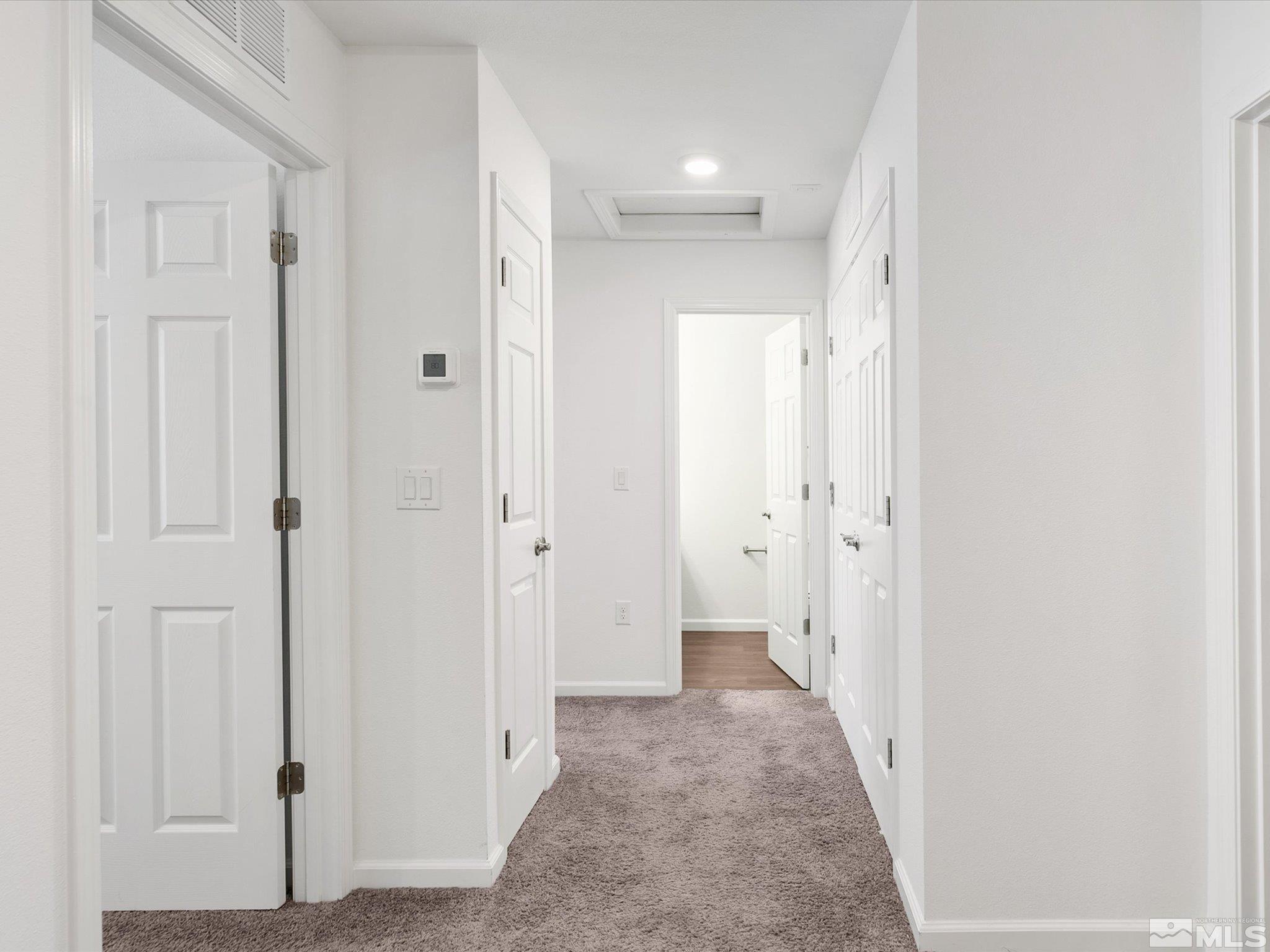 405 Autumn Breeze Circle Reno, NV 89511 - Photo 15 of 28 a view of a hallway with wooden door