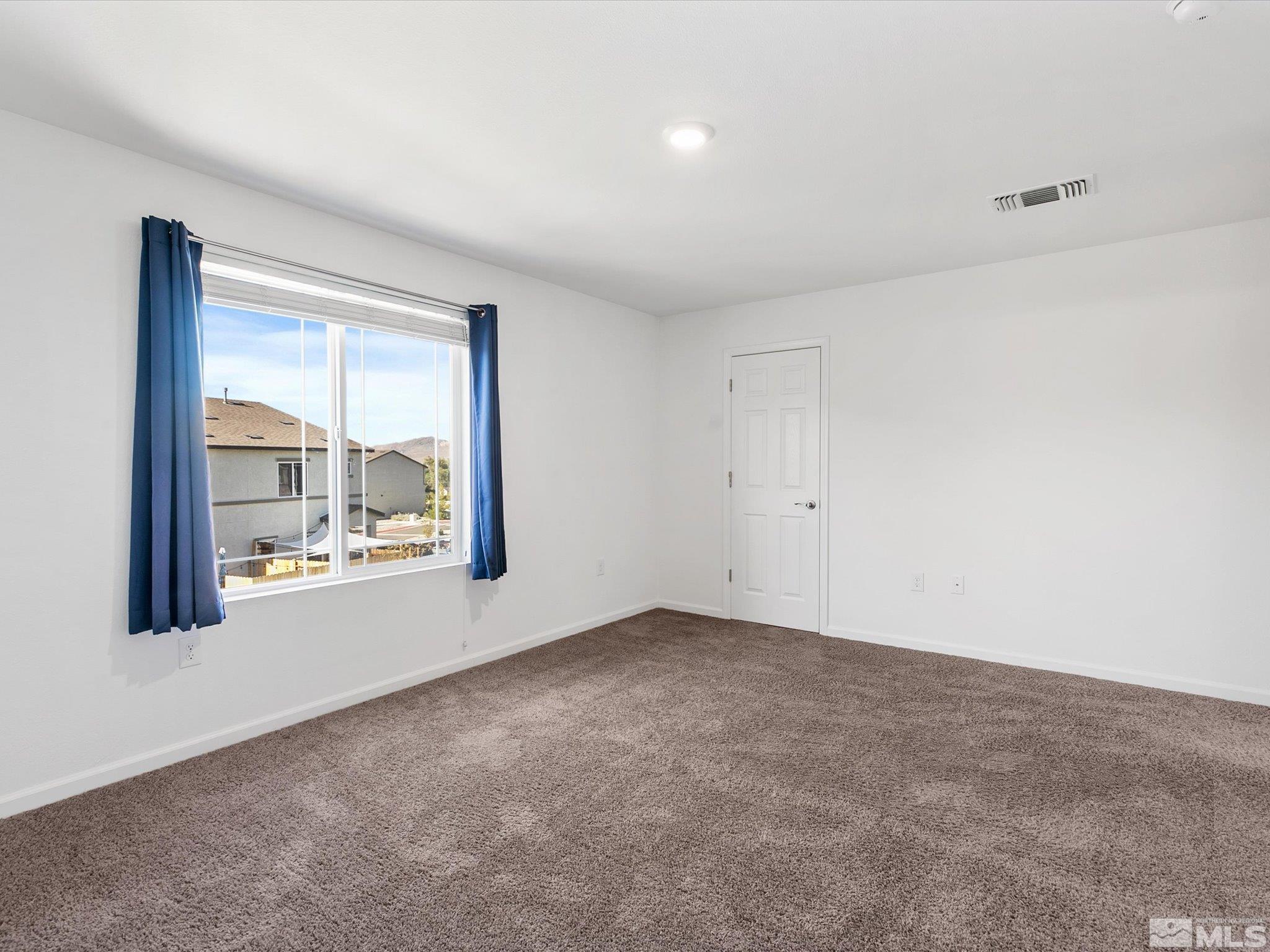405 Autumn Breeze Circle Reno, NV 89511 - Photo 19 of 28 a view of an empty room with a window