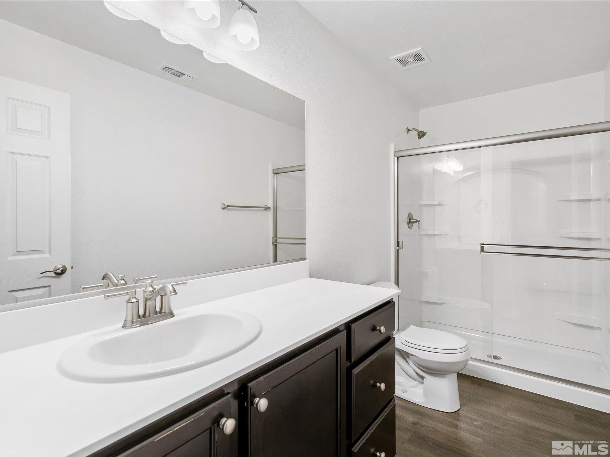 405 Autumn Breeze Circle Reno, NV 89511 - Photo 20 of 28 a bathroom with a sink a toilet and shower