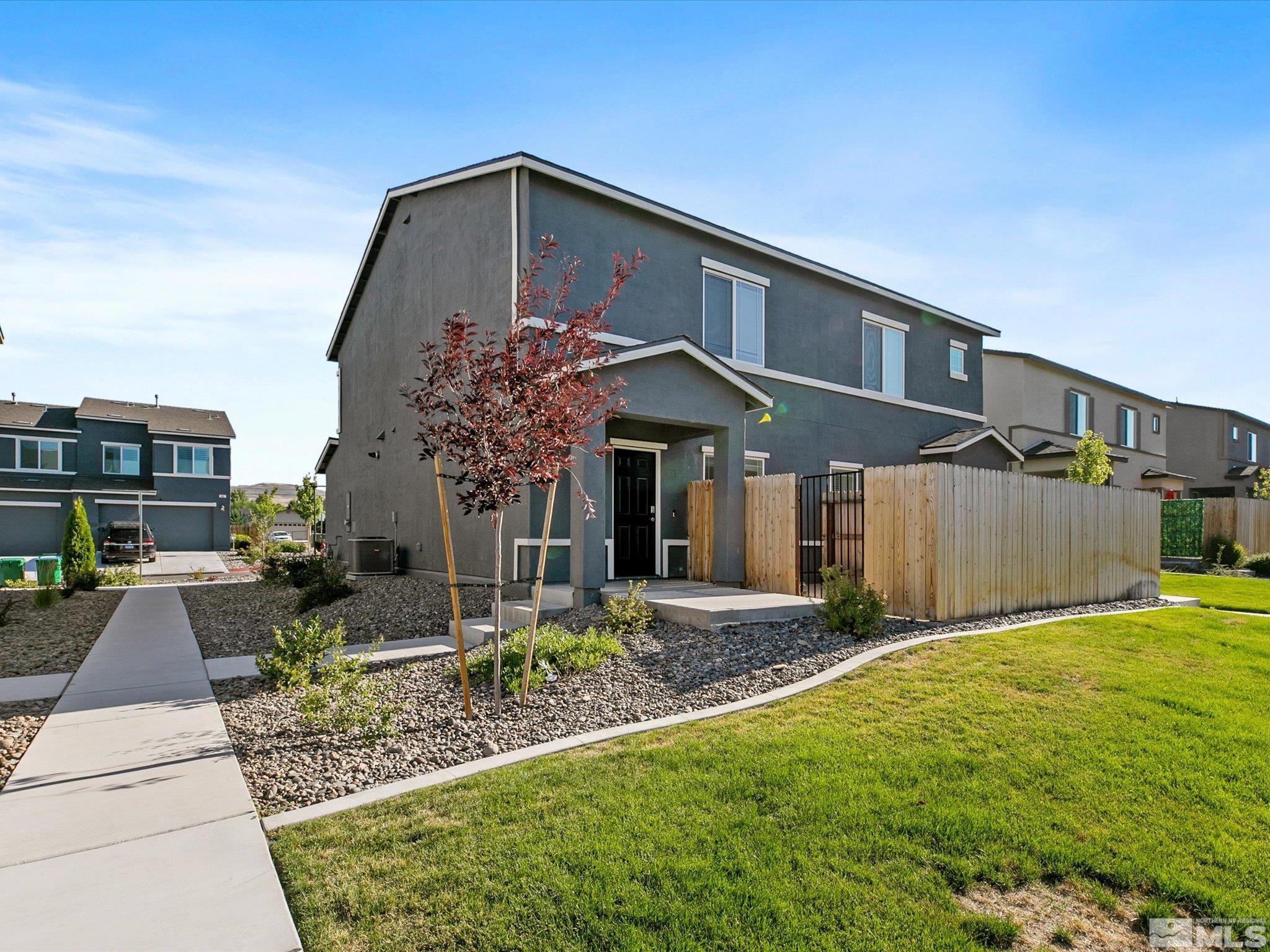 405 Autumn Breeze Circle Reno, NV 89511 - Photo 2 of 28 a front view of a house with garden