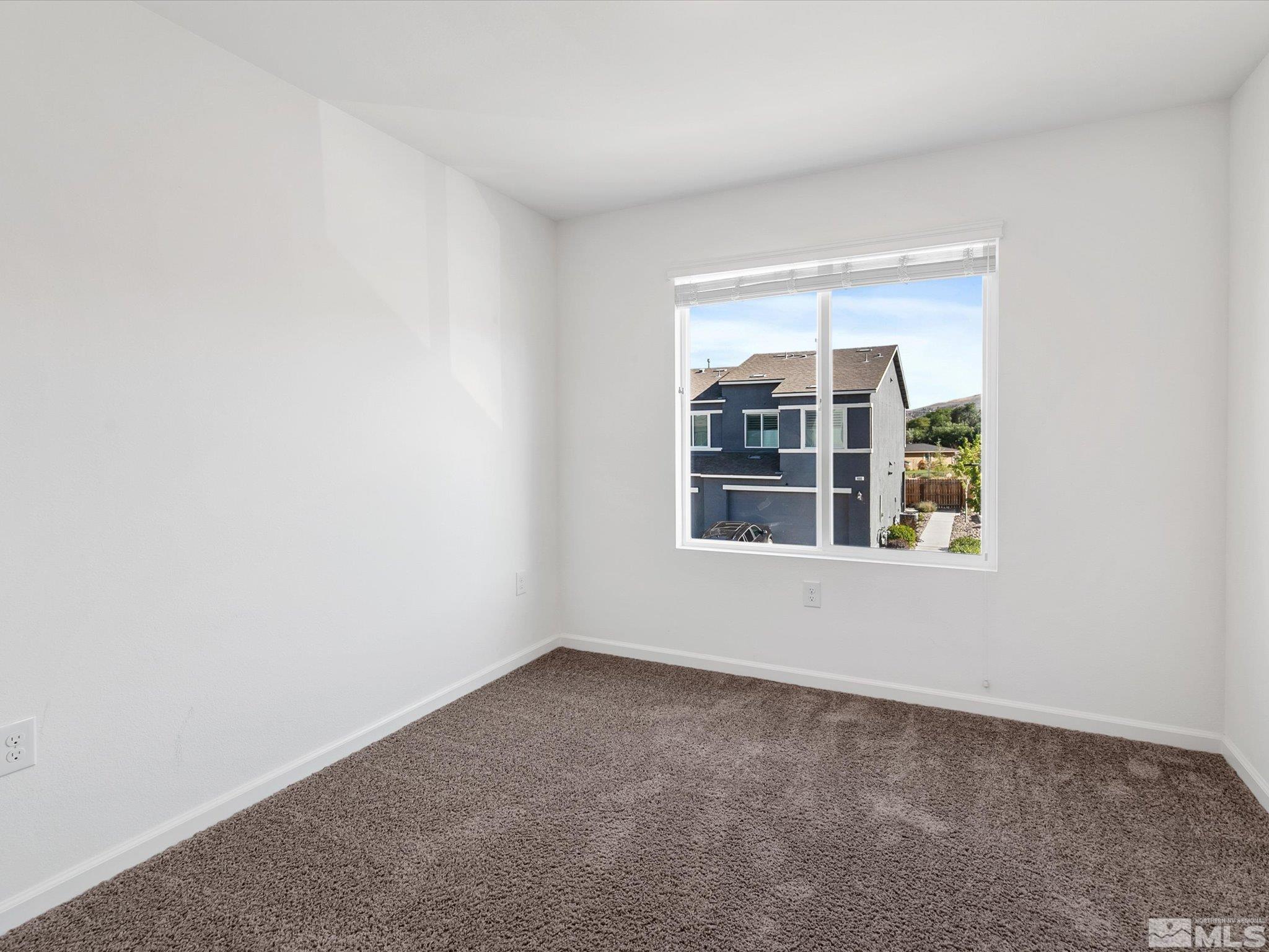 405 Autumn Breeze Circle Reno, NV 89511 - Photo 21 of 28 a view of an empty room with a window