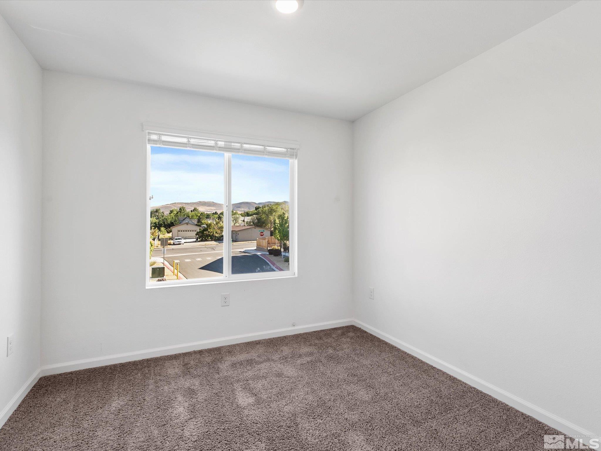 405 Autumn Breeze Circle Reno, NV 89511 - Photo 23 of 28 an empty room with a window