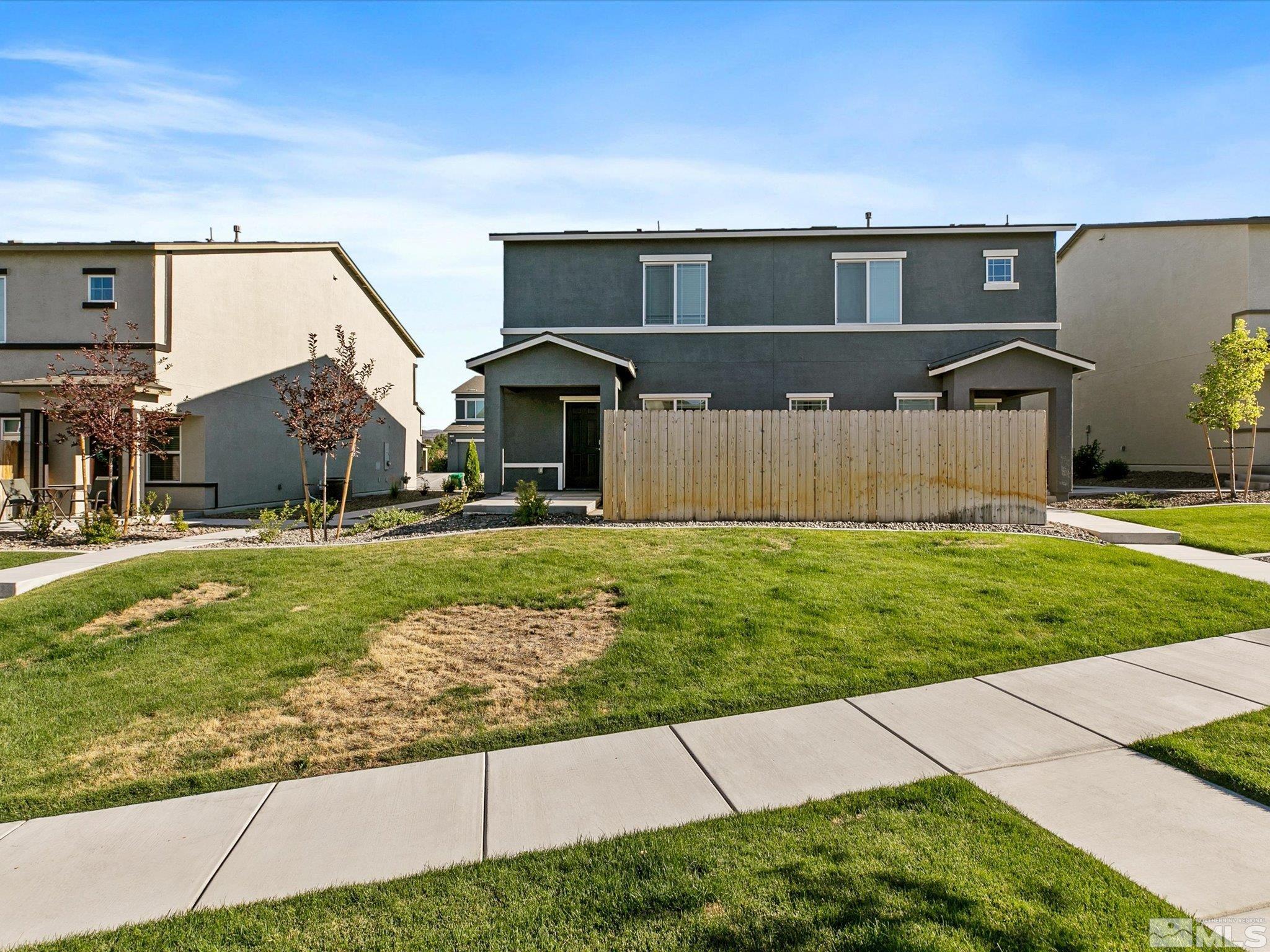 405 Autumn Breeze Circle Reno, NV 89511 - Photo 3 of 28 a front view of a house with a yard