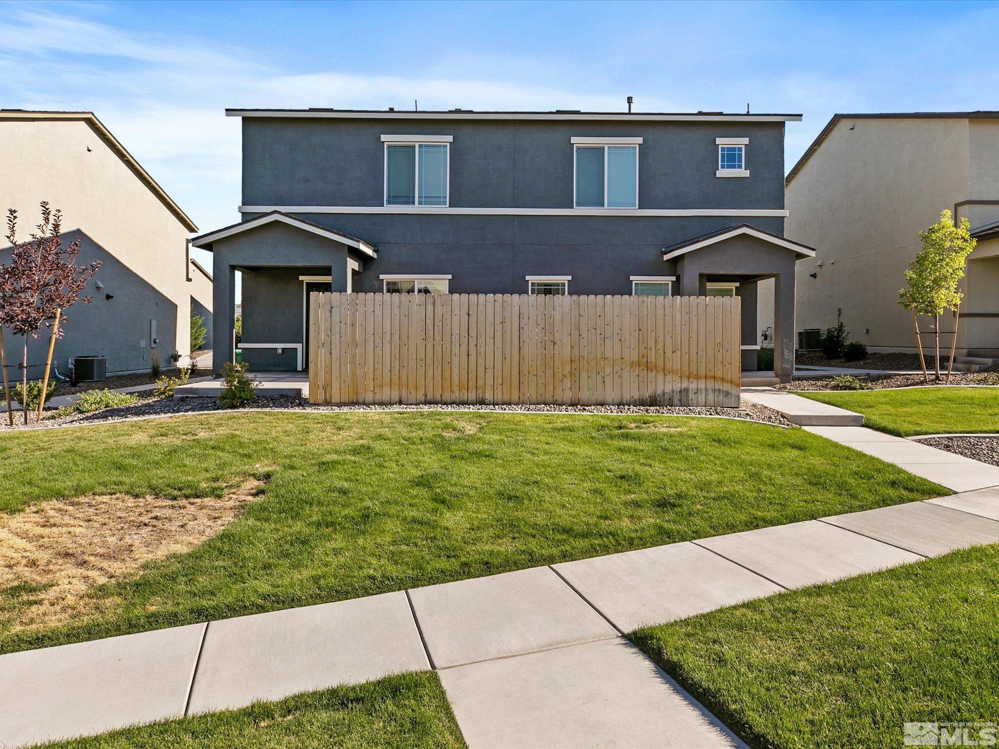 405 Autumn Breeze Circle Reno, NV 89511 - Photo 4 of 28 a front view of a house with a yard