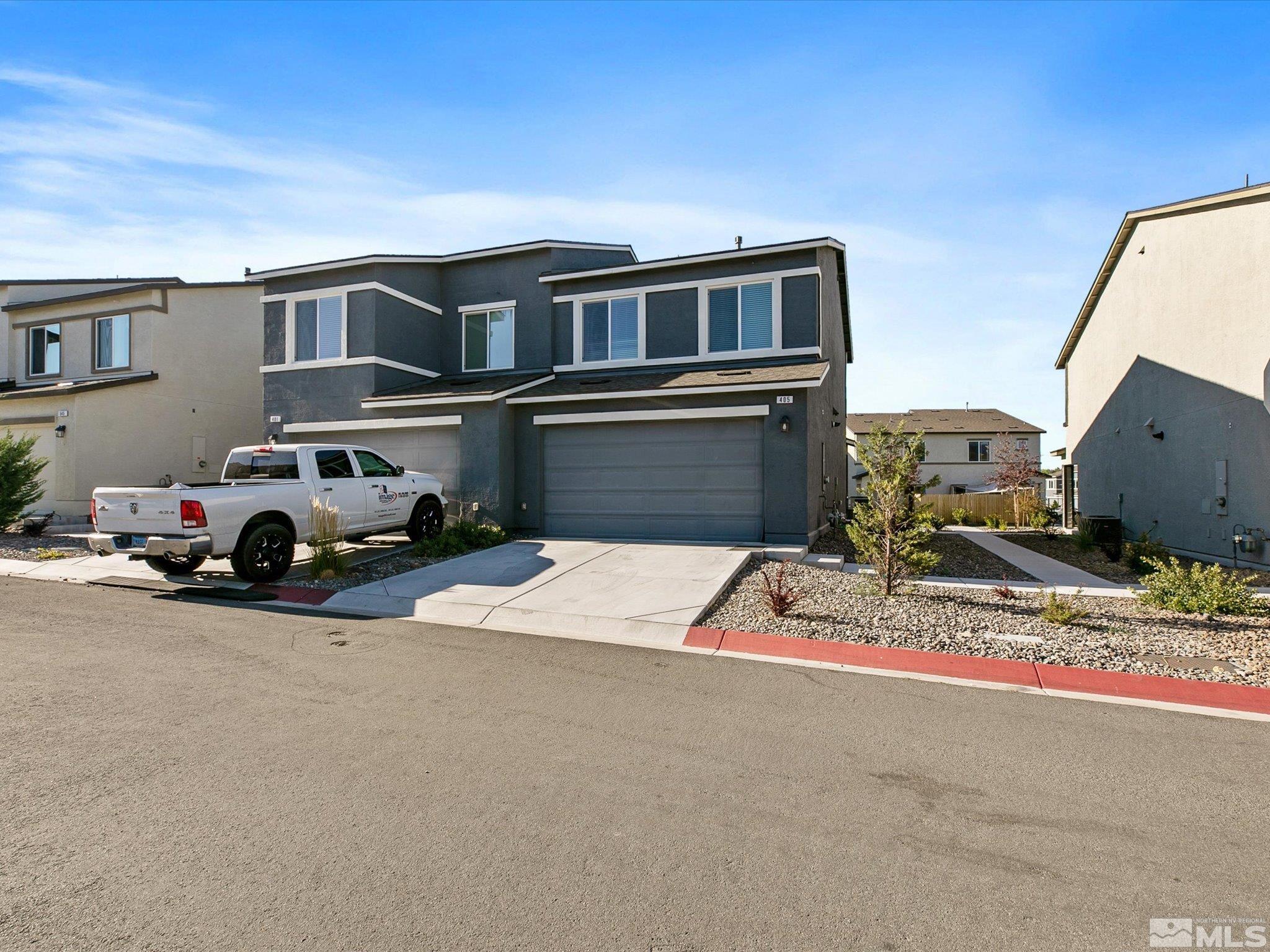 405 Autumn Breeze Circle Reno, NV 89511 - Photo 5 of 28 a car parked on the side of the road