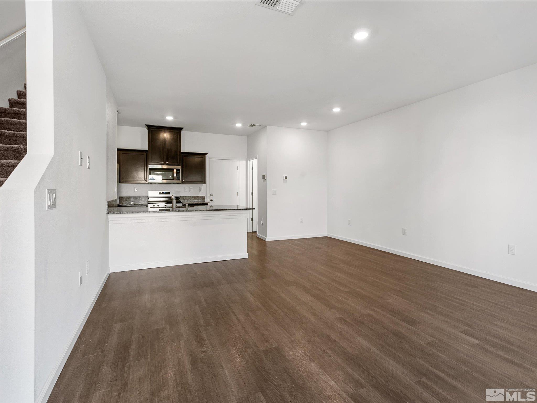 405 Autumn Breeze Circle Reno, NV 89511 - Photo 6 of 28 a view of kitchen with microwave and cabinets