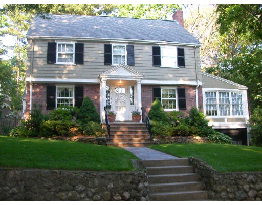 a front view of a house with a yard