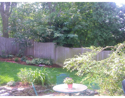 30 Allen Road Winchester, MA 01890 - Photo 3 of 9 a view of a backyard with plants and a garden
