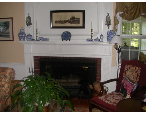 30 Allen Road Winchester, MA 01890 - Photo 7 of 9 a living room with furniture and a fireplace