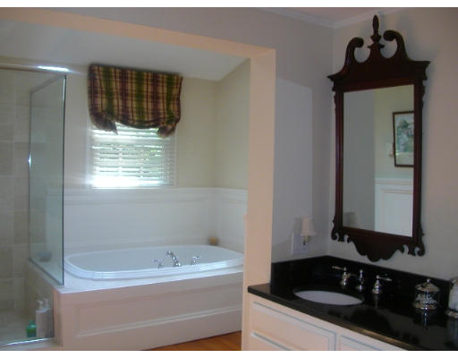 30 Allen Road Winchester, MA 01890 - Photo 9 of 9 a bathroom with a bathtub sink and mirror