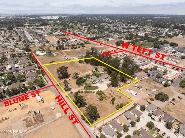 an aerial view of beach and residential houses