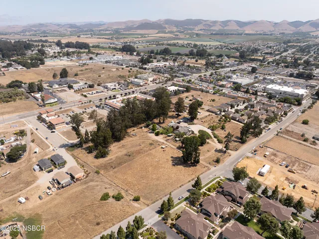 an aerial view of residential building and ocean view