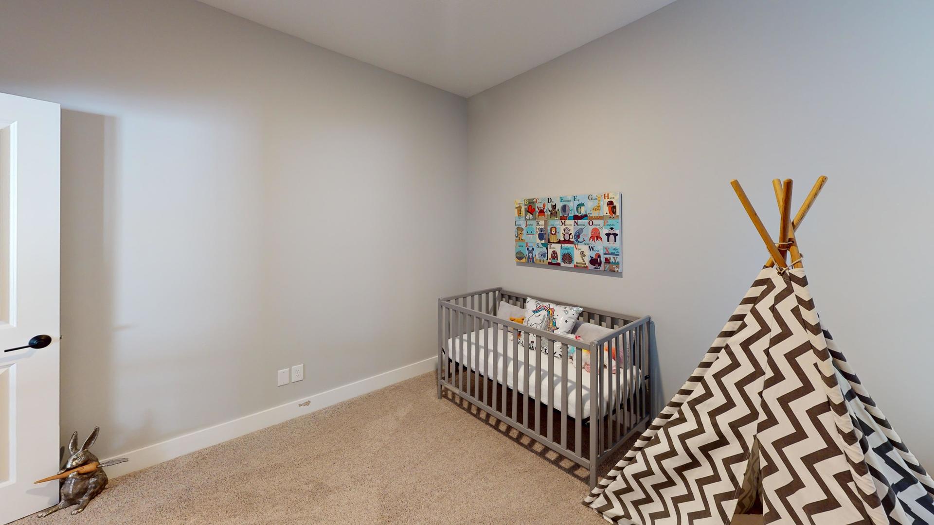 8-1 West Orchid Lane, Unit 1 Channahon, IL 60410 - Photo 13 of 28 a bedroom with a bed and a window