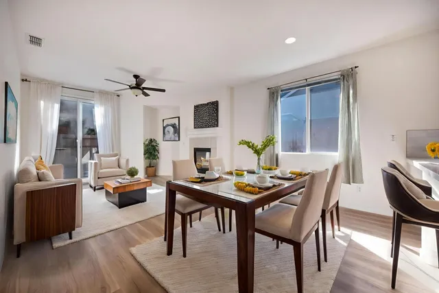 a view of empty room with wooden floor and fireplace