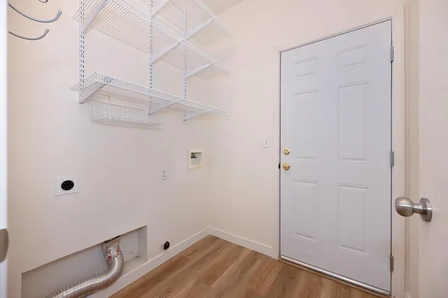 a bedroom with bed and a potted plant