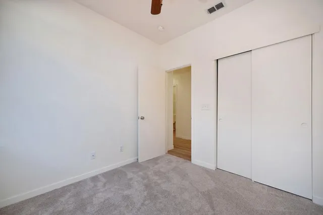 a bathroom with a granite countertop toilet sink and shower