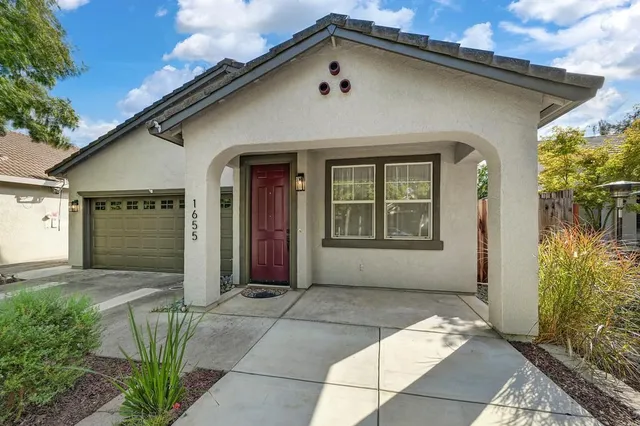 a front view of a house with a large windows