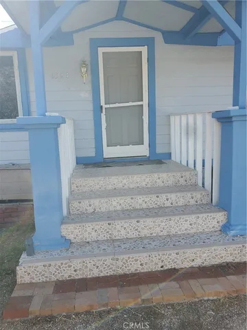 a view of staircase with white walls