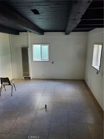 a kitchen with a stove a sink and a refrigerator