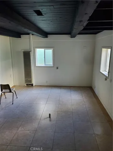 a kitchen with a stove a sink and a refrigerator