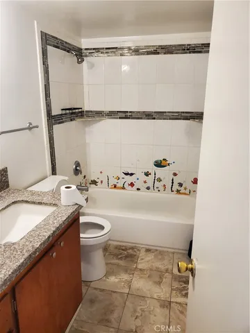 a view of a bathroom from a hallway