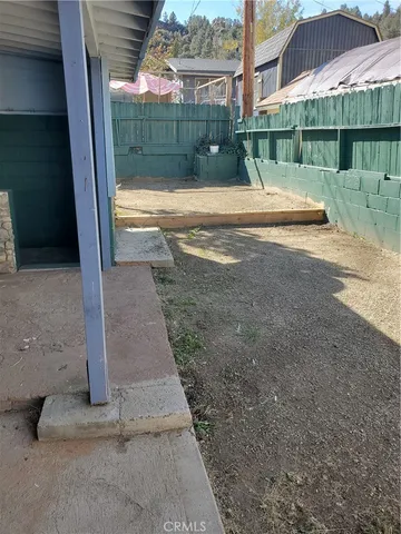 a view of backyard with green space