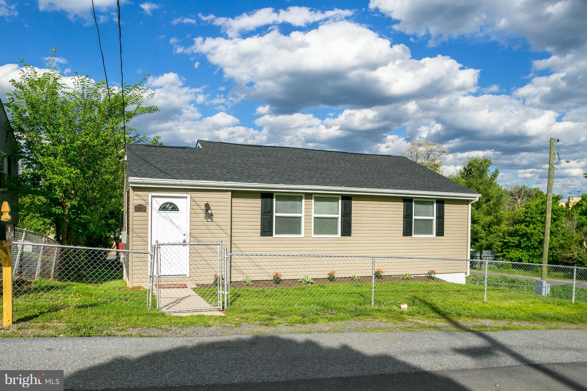 207 South Reymann Street Ranson, WV 25438 - Photo 2 of 24 a house that has a lot of windows in it