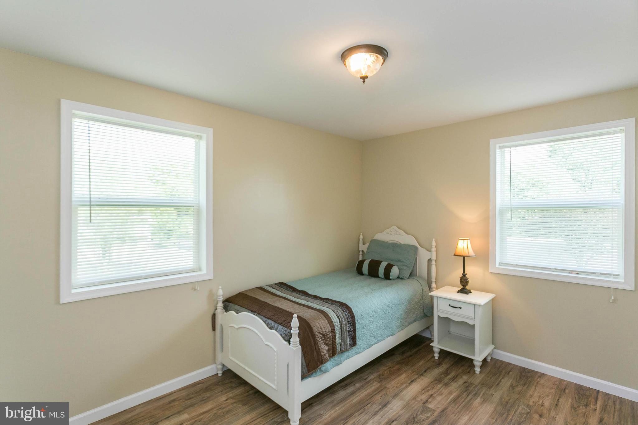 207 South Reymann Street Ranson, WV 25438 - Photo 20 of 24 a bedroom with a bed and window