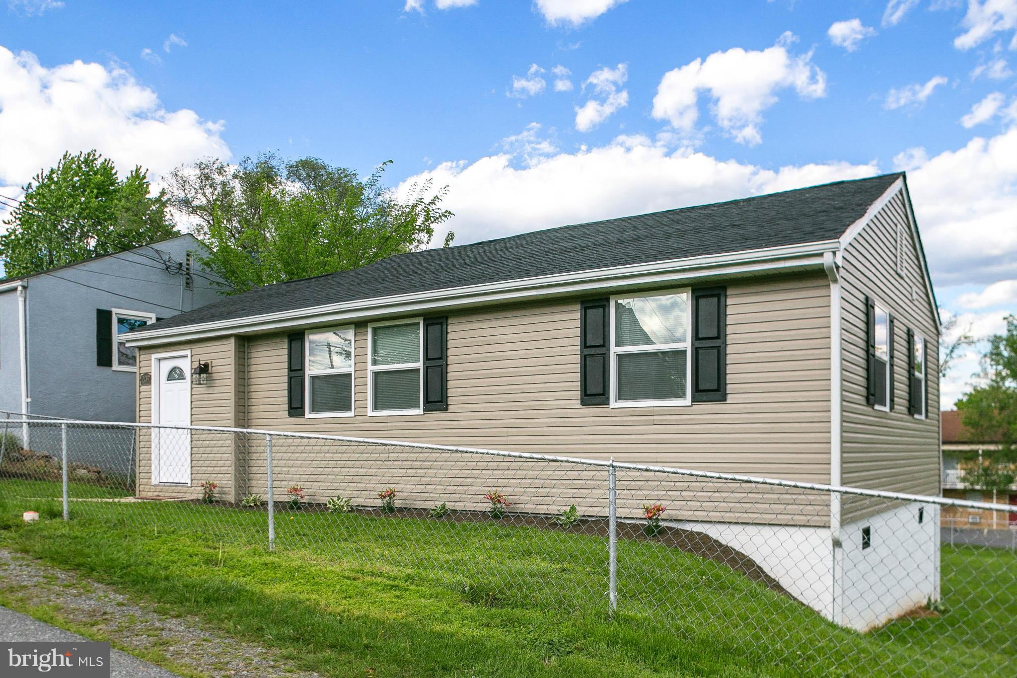 207 South Reymann Street Ranson, WV 25438 - Photo 3 of 24 a view of a house with a backyard