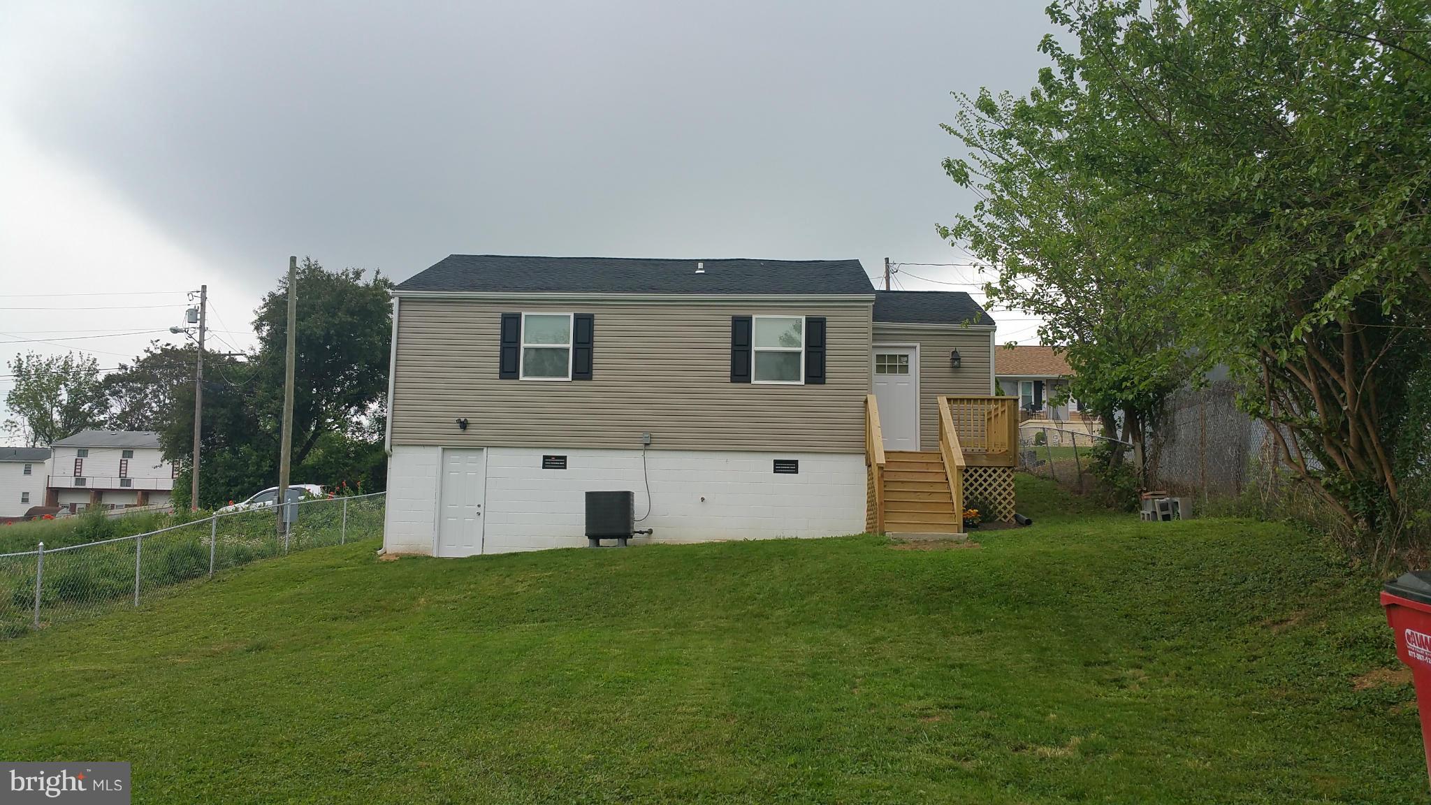 207 South Reymann Street Ranson, WV 25438 - Photo 24 of 24 a house view with a garden space
