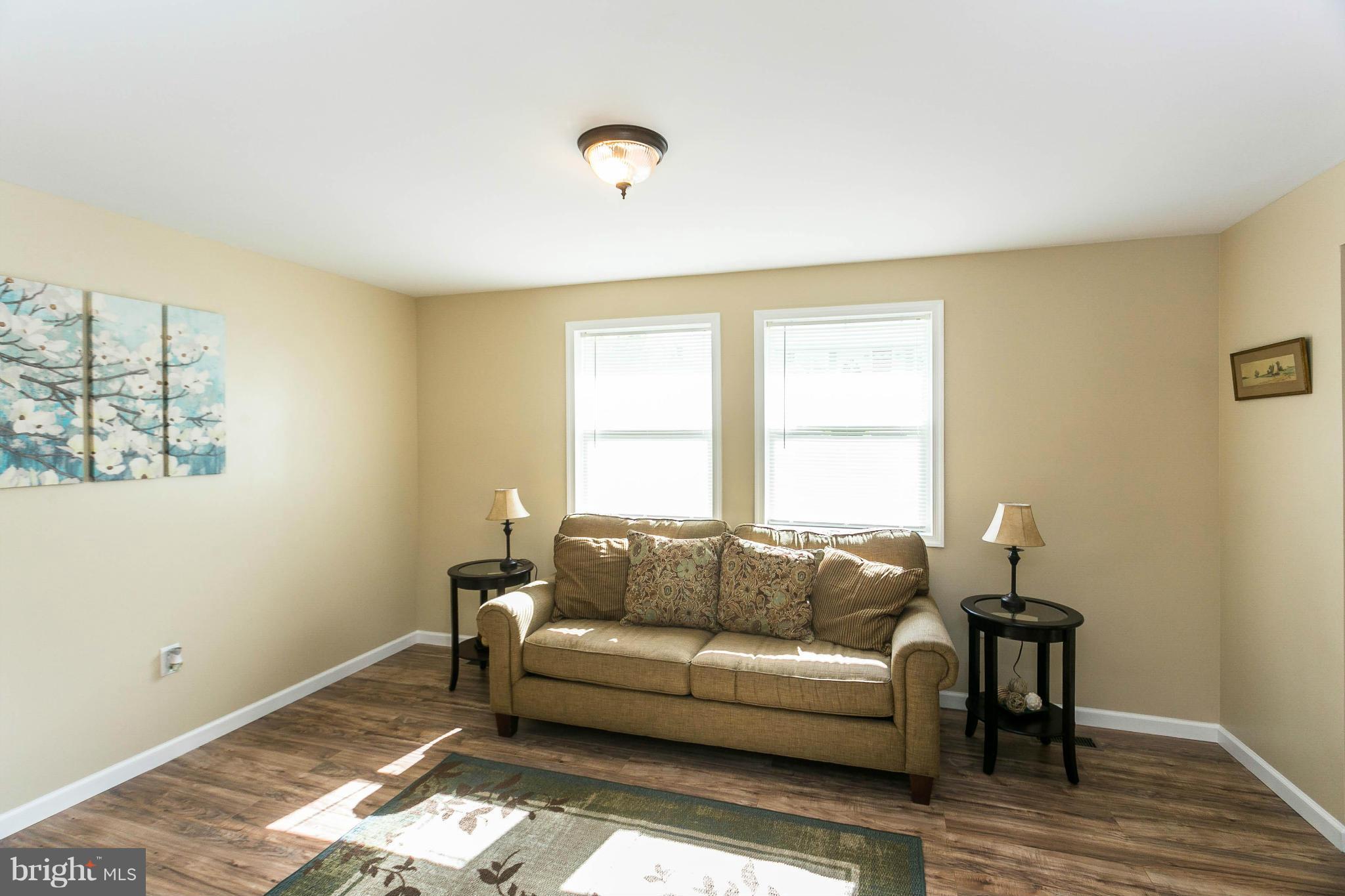 207 South Reymann Street Ranson, WV 25438 - Photo 6 of 24 a living room with furniture and window