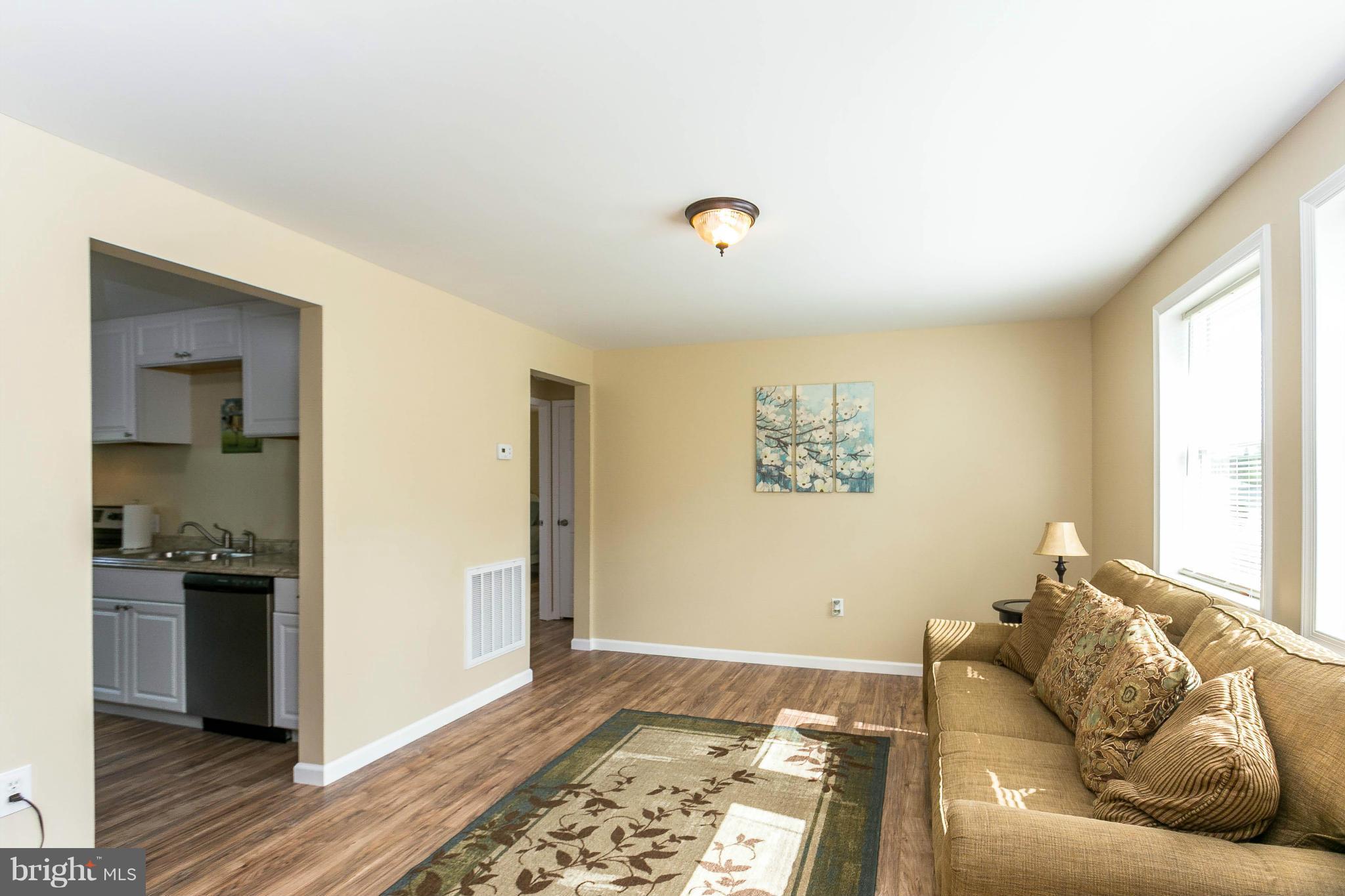207 South Reymann Street Ranson, WV 25438 - Photo 7 of 24 a living room with furniture and a rug