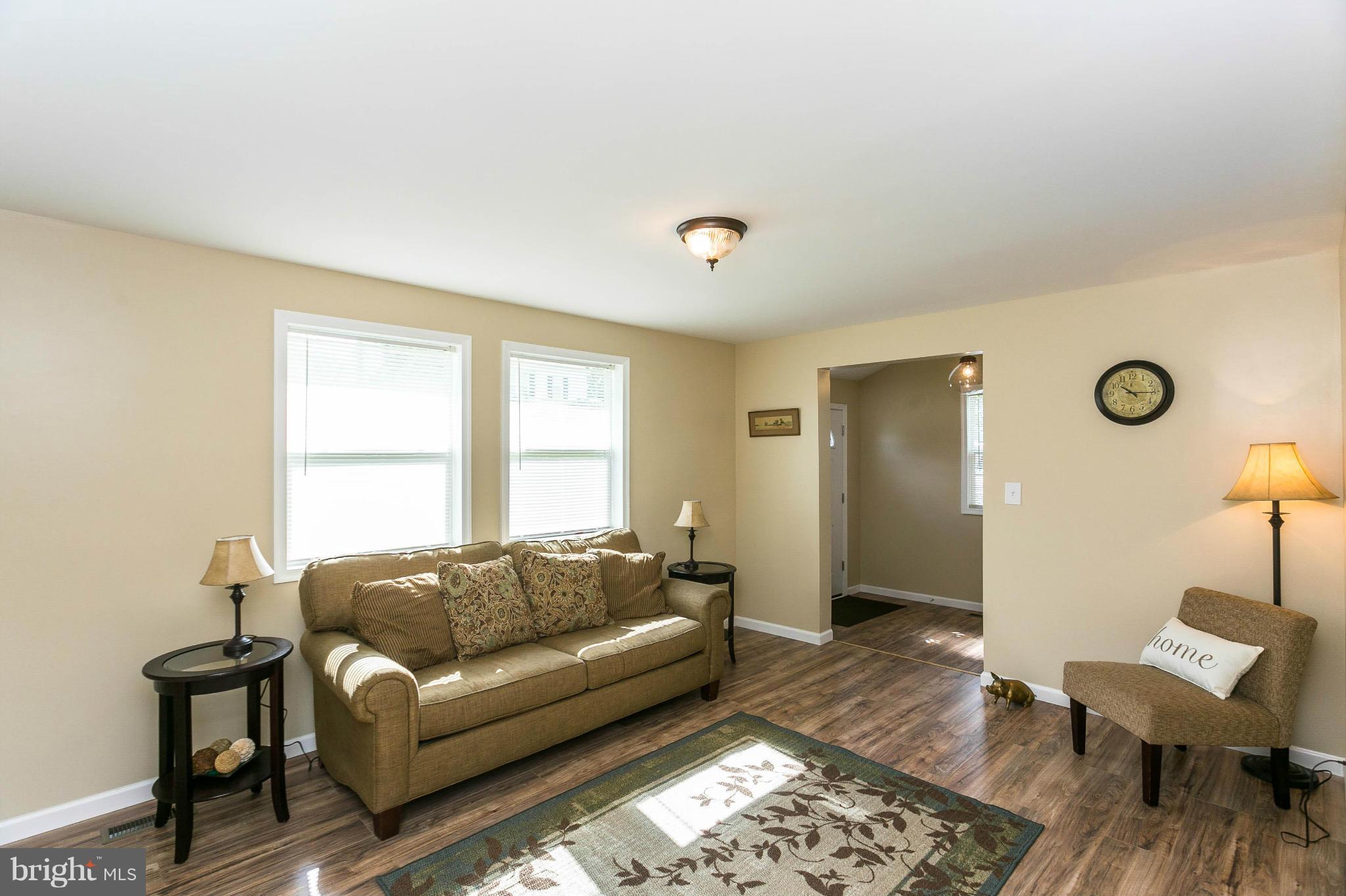 207 South Reymann Street Ranson, WV 25438 - Photo 8 of 24 a living room with furniture and a window