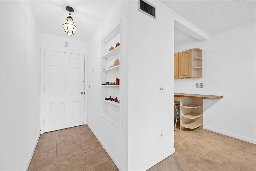 2501 South Ocean Boulevard, Unit 301 Boca Raton, FL 33432 - Photo 16 of 32 a view of a hallway with workspace