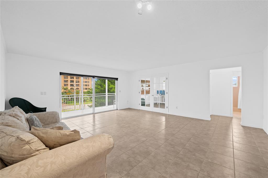 2501 South Ocean Boulevard, Unit 301 Boca Raton, FL 33432 - Photo 17 of 32 a living room with furniture and a large window